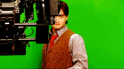 Daniel Radcliffe as Harry Potter, shrugging